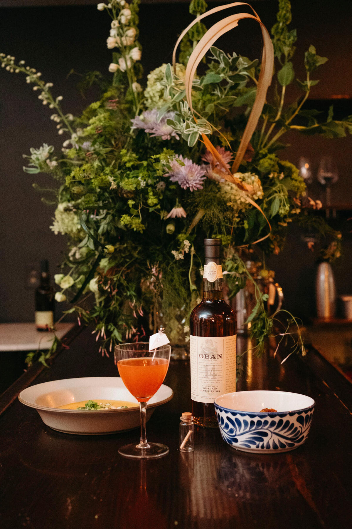 Garden-style arrangement styled on a bar for an Oban whisky activation